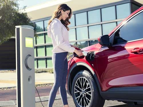 2023 Ford Escape Plug-in Hybrid charging at a charging station