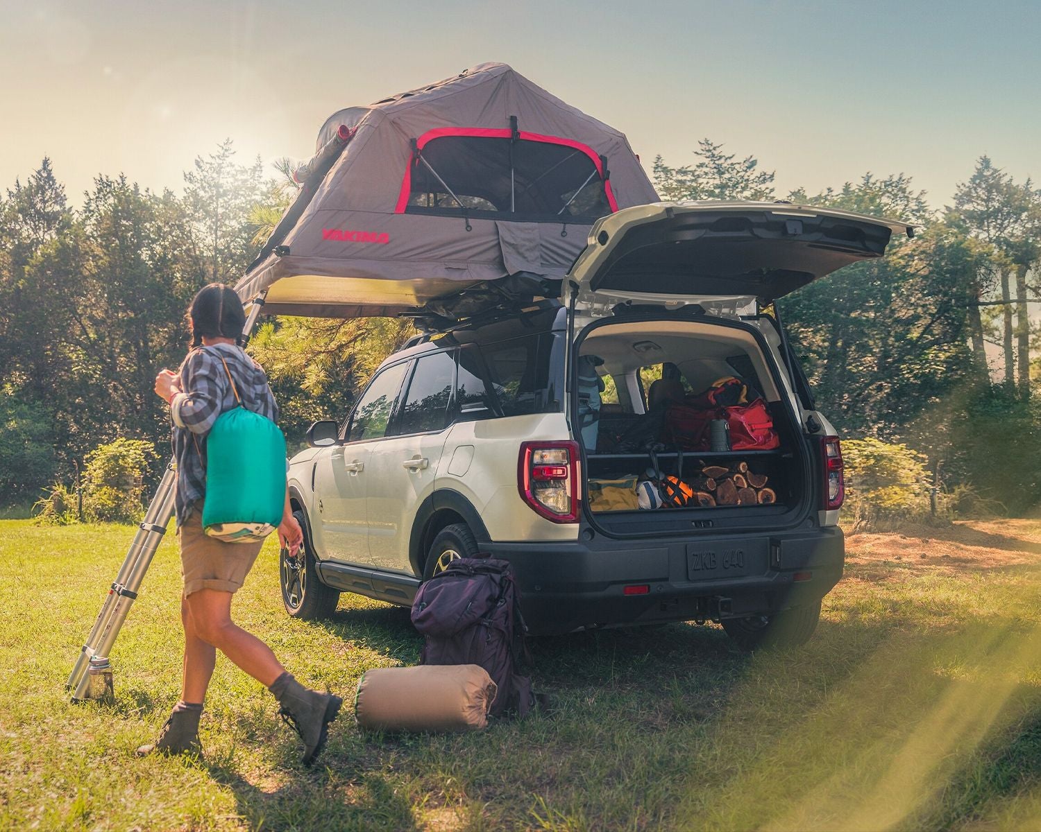 2024 Ford Bronco® Sport shown with a tent on the roof, parked in the grass