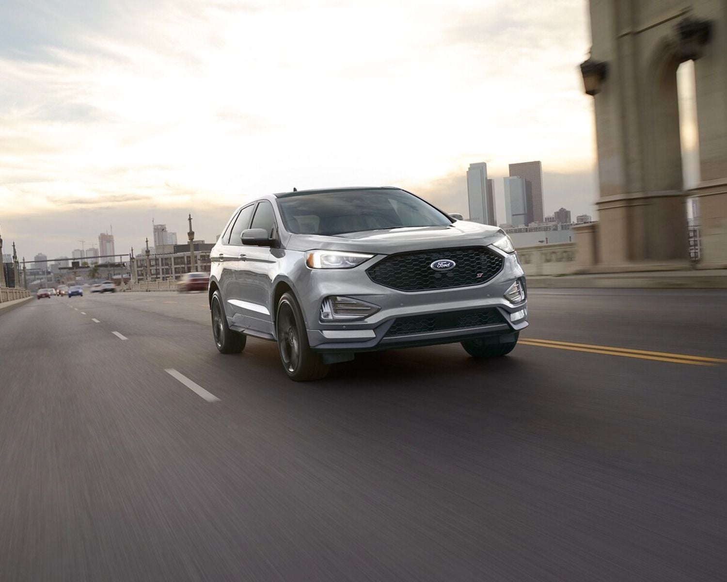 Side view of the 2024 Ford Edge driving through the city