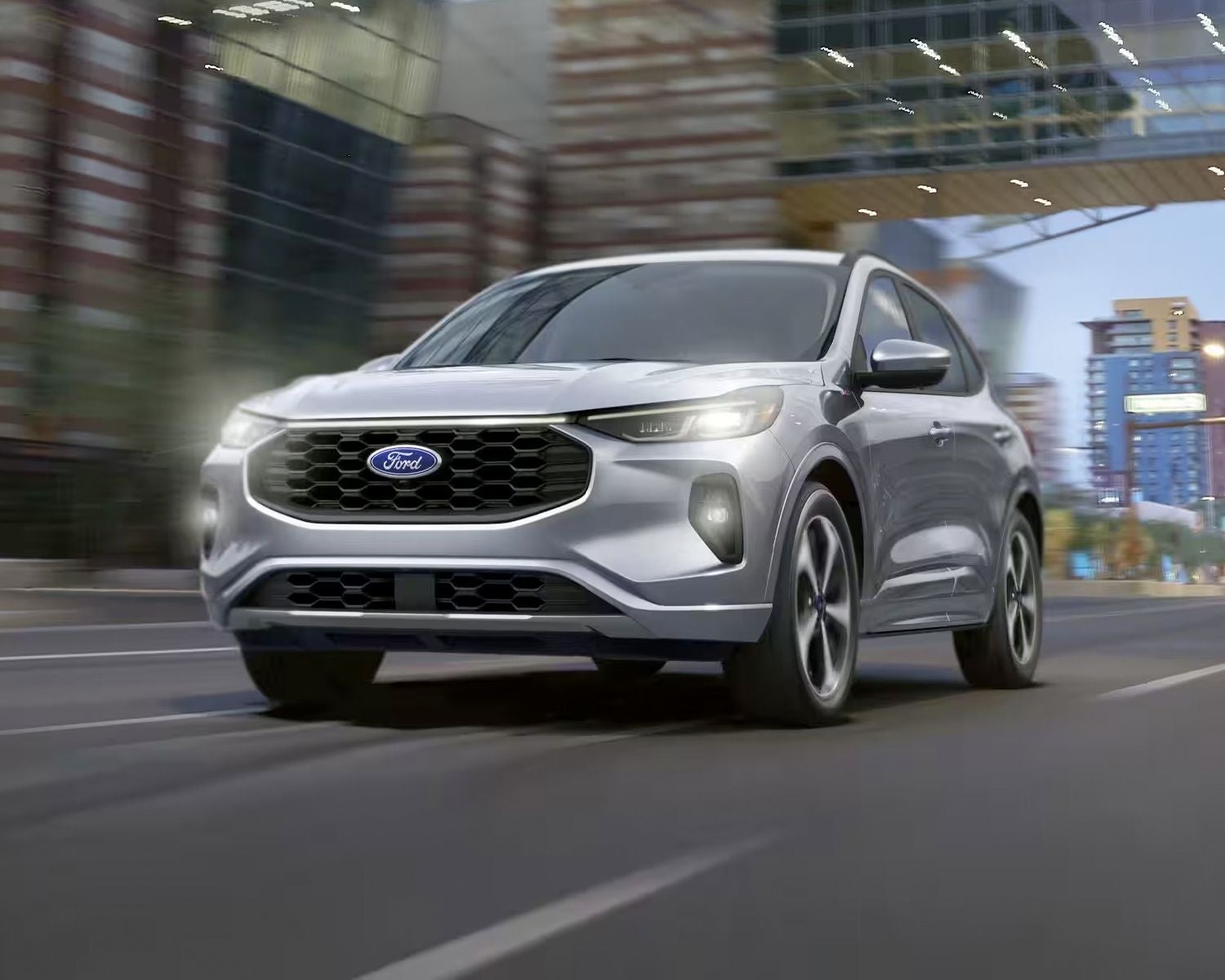 Silver 2024 Ford Escape driving through the city